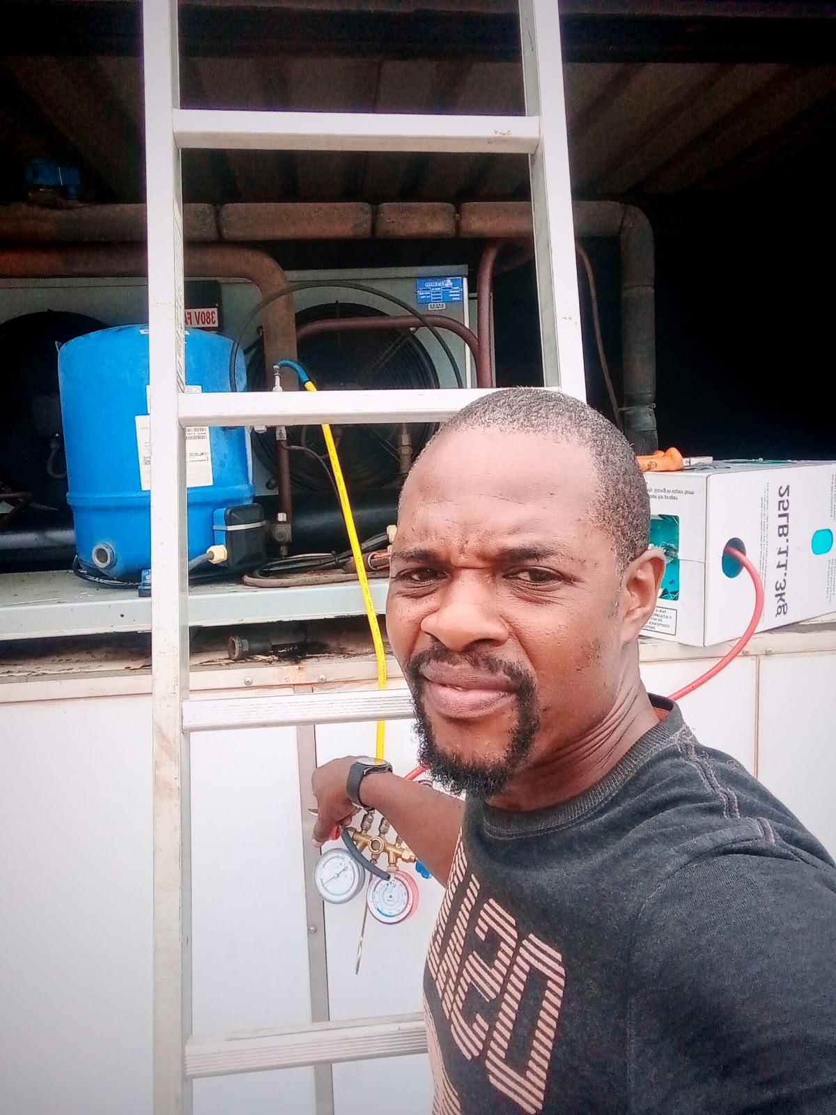 Technician working on pumps in a plant room