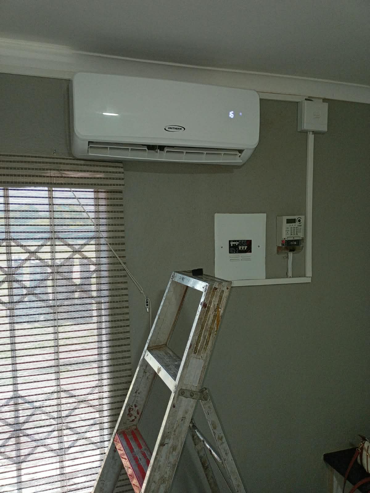 Indoor wall-mounted air conditioner being fitted